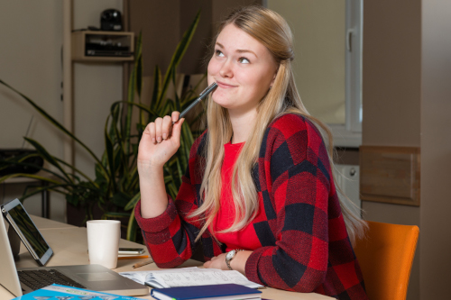 thoughtful businesswoman sitting desk office